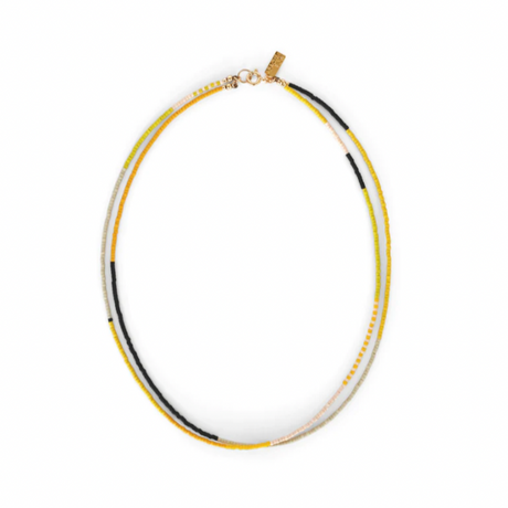 A Yellow Sun double stranded necklace by Abacus Row is a sunny bright palette of pink and yellow hues accented with sharp black detail to welcome a bright and hopeful summer.