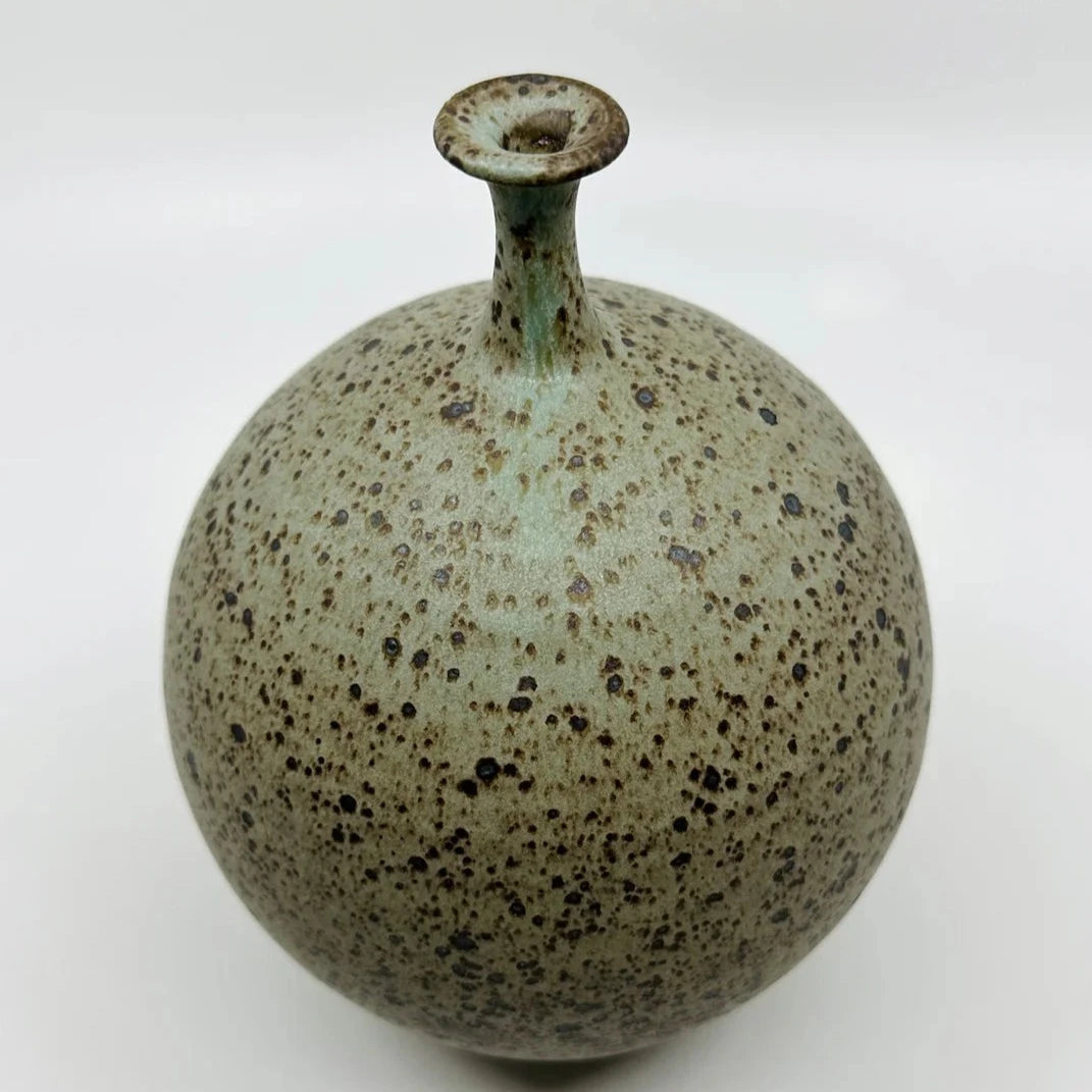 No 24 by Dana Chieco is her gorgeous take on the bottleneck form. This vase is a deep speckled clay with blue and pistachio glazed tones.