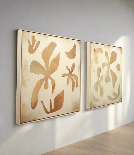 Two abstract wall art pieces using natural pigments, acrylics and pastels by Danielle Hutchens shown on a wall side by side