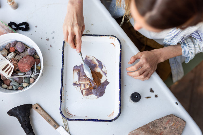 Artist Danielle Hutchens making painting pigment from rocks and stones