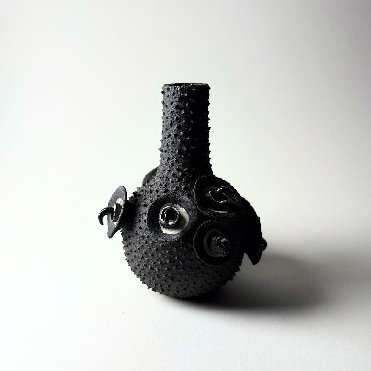 Dark and Spiky Vase by Avigail Remak From the Desert Rising collection, inspired by the resilient plants of the desert, their forms, textures, surprising variety, and their tough defenses of spikes and thorns.