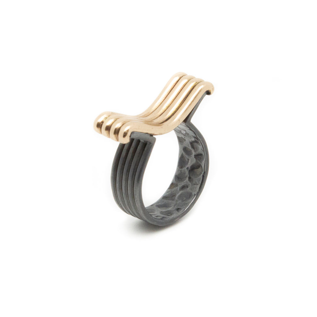 We love the architectural details of the Wavy ring, hand-formed and cast in oxidized sterling silver (band) and bronze (the wavy). A bold piece with a textural profile!