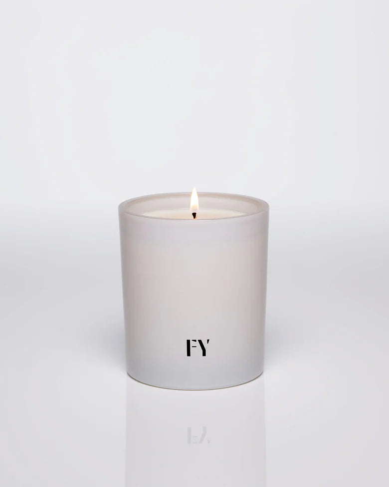 Breathtakingly fresh and undeniably complex, AIR candles by Free Yourself are a harmonizing scent of grapefruit, ginger, vetiver, solar notes, and moss. The fragrance is a woody aromatic masterpiece that defies traditional boundaries. 10 oz glass vessel.
