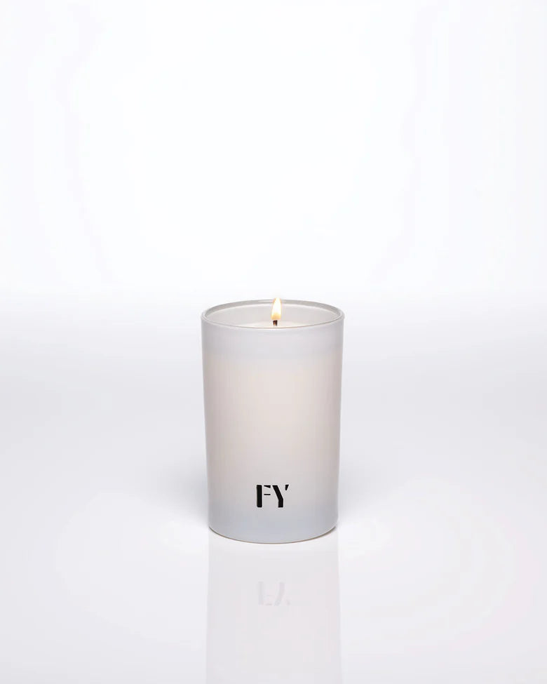 Breathtakingly fresh and undeniably complex, AIR candles by Free Yourself are a harmonizing scent of grapefruit, ginger, vetiver, solar notes, and moss. The fragrance is a woody aromatic masterpiece that defies traditional boundaries. 4 oz tall glass votive.