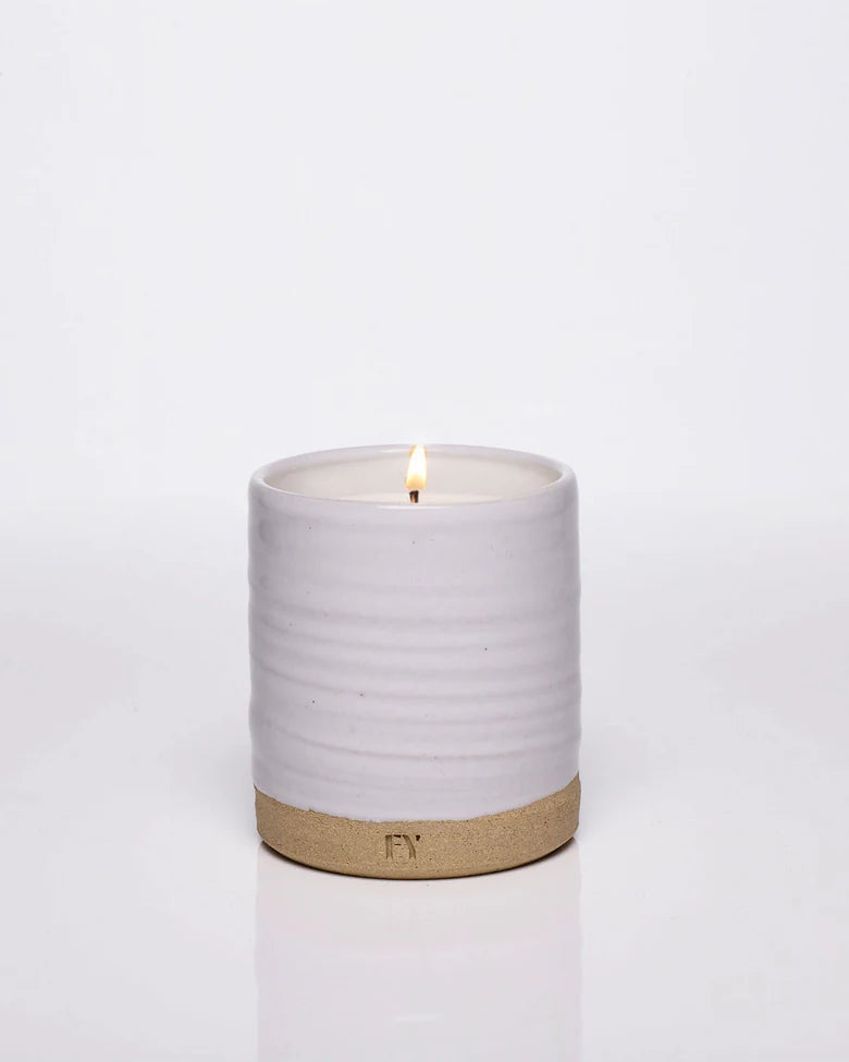 FEU candles by Free Yourself are a passionate declaration with a warm, spicy scent of clove, cinnamon, neroli, smoky woods and leather. The base of labdanum, tonka and cedarwood ensures a sensual, memorable finish. Wheel Thrown Ceramic resuable vessel made in Vermont.