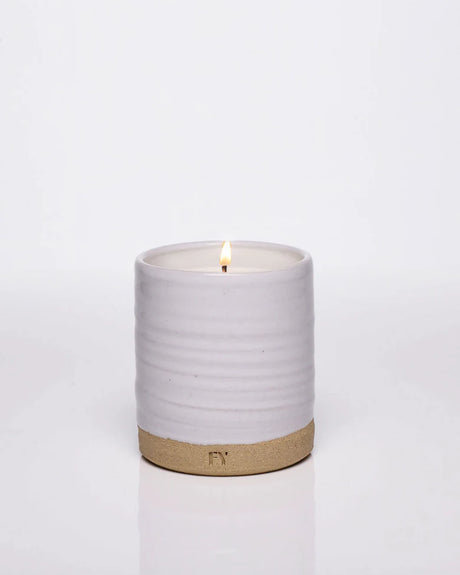 A water obsession comes to life with EAU candles by Free Yourself. Your guide to introspection and peace, EAU is a multi-dimensional melody of grapefruit, pink pepper, gardenia and aquatic nuances. In a wheel thrown ceramic vessel made in Vermont and handpoured clean candle with coconut and apricot wax.