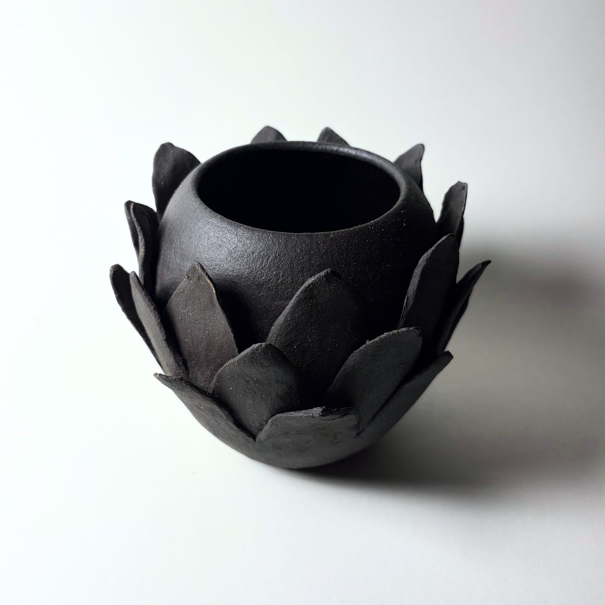 Flowering Vase. From the Desert Rising collection, inspired by the resilient plants of the desert, their forms, textures, surprising variety, and their tough defenses of spikes and thorns. Avigail Remak makes one of a kind ceramic vases, baskets and bowls. 