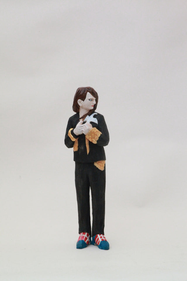 Swan Female Sculpture in Wood. Swan with her black suit, cool kicks, golden details annnnd with golden feathers sprouting from her back gives David Bowie vibes