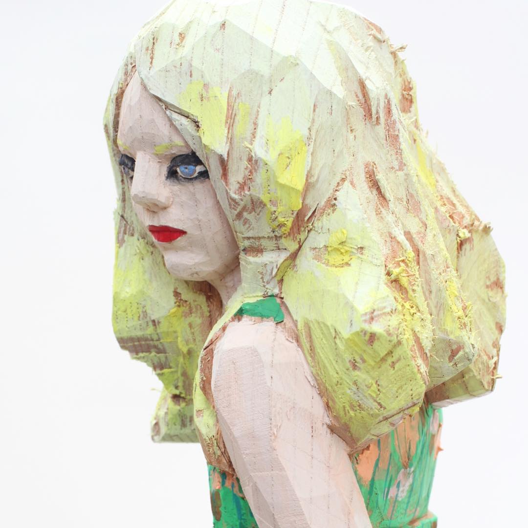 Detail of face of Monet, wood carved female figure by Hideki Iinuma, Japanese artist.