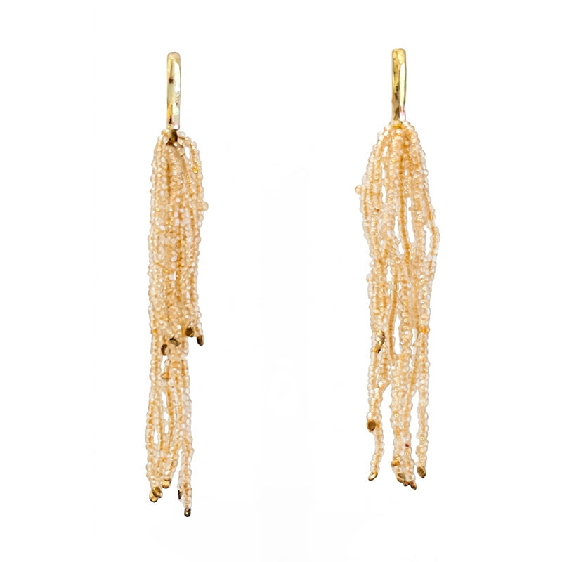 4" long cascading seed bead chandelier fringe earrings combine a golden seed bead with hammered brass details.