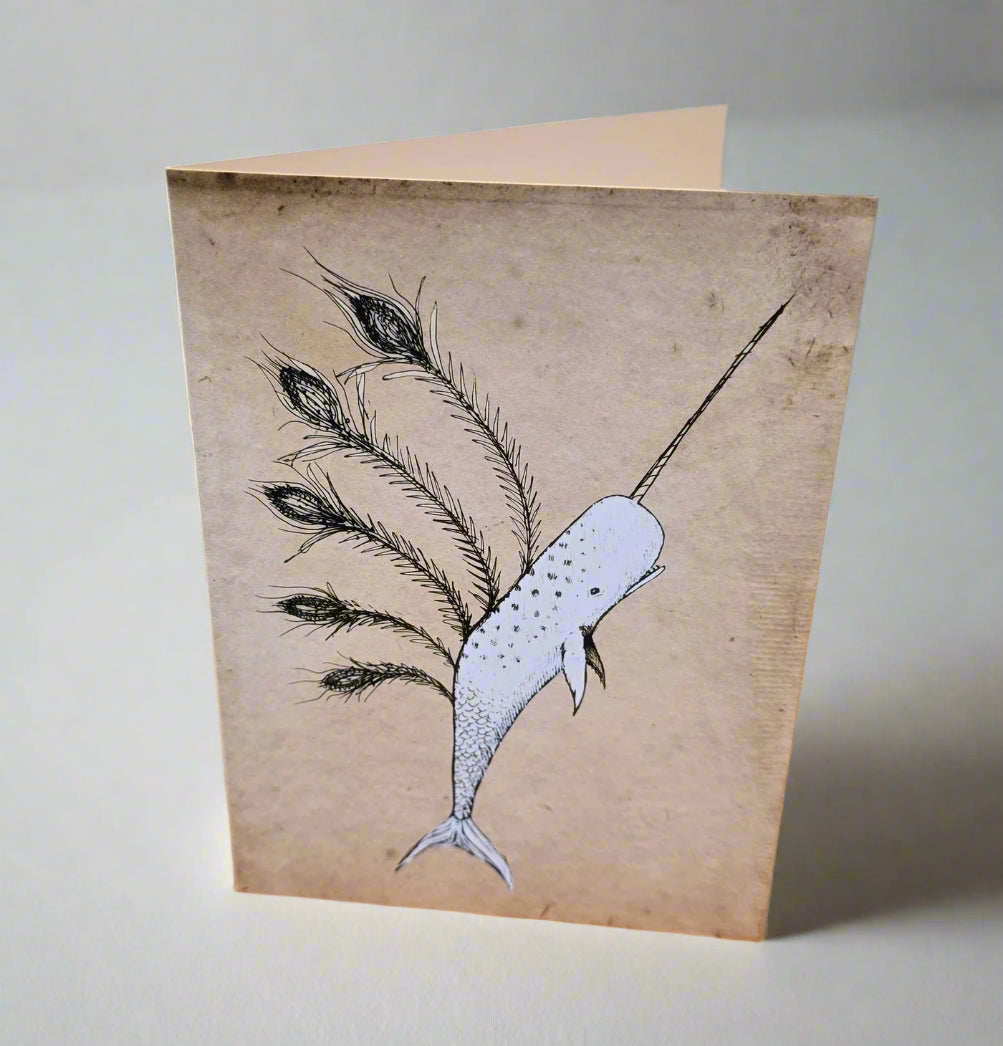 Card with a drawing of a narwhal and feathers