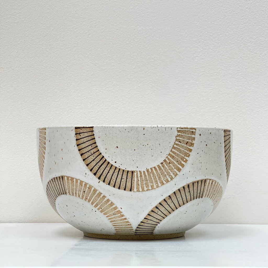 Pasta, quinoa, a layered green salad or beet salad. Start a new ritual with this perfectly sized medium bowl design by Julems, decorated with half circles.