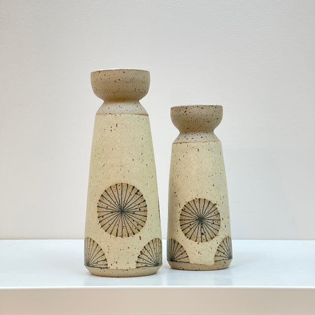 A sweet pair of vases in light yellow with a radial design for displaying your fave bouquet. Judith Lemmens, designer behind the Julems line of wheel thrown ceramics, draws each of her Scandinavian inspired designs atop her gorgeous forms.