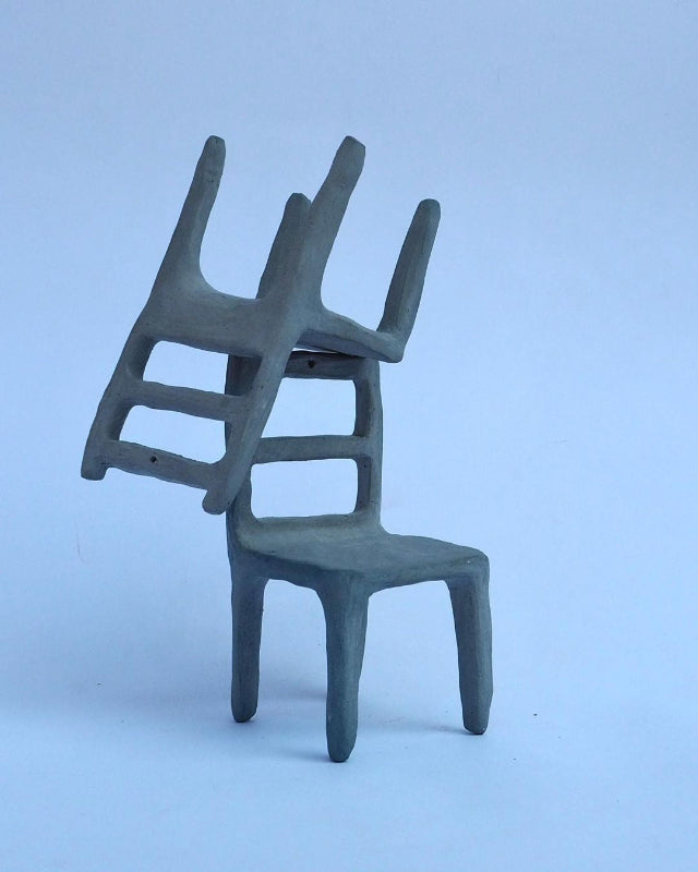 Small ceramic blue chair sculptures