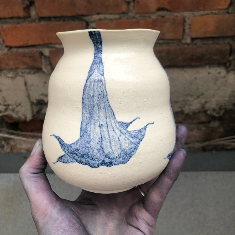 Ceramic vase with blue watercolor paintings of trumpet flowers