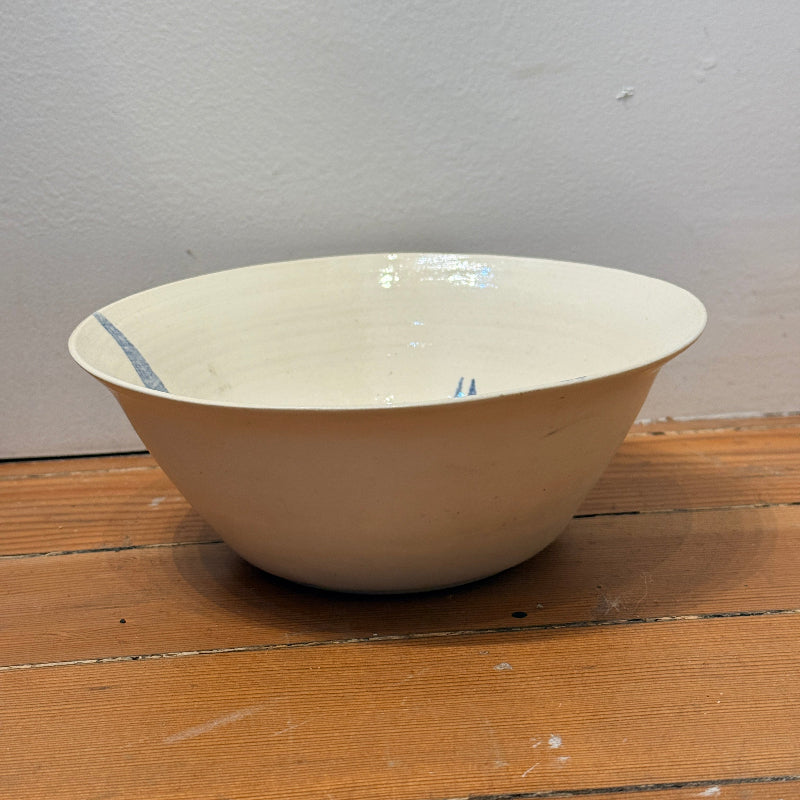 Ceramic eating or serving bowl with blue watercolor painting of trumpet flowers and its pollinating moth. Side View.