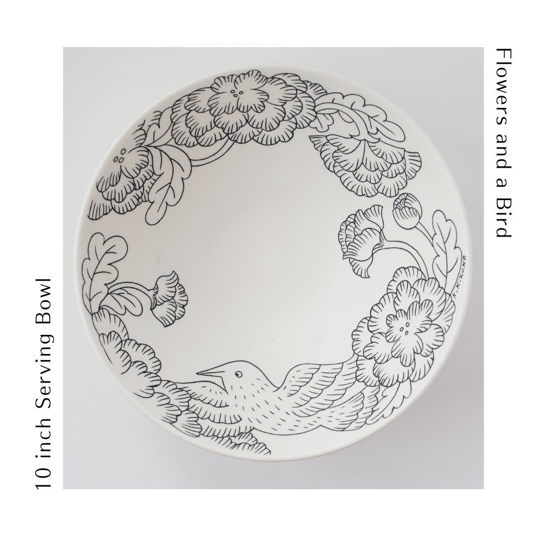 This 10" serving bowl in porcelain is great for a spring salad, pasta or a decorative object. The bowl is wheel thrown and then decorated in an inlay technique of a flying bird and flowers.