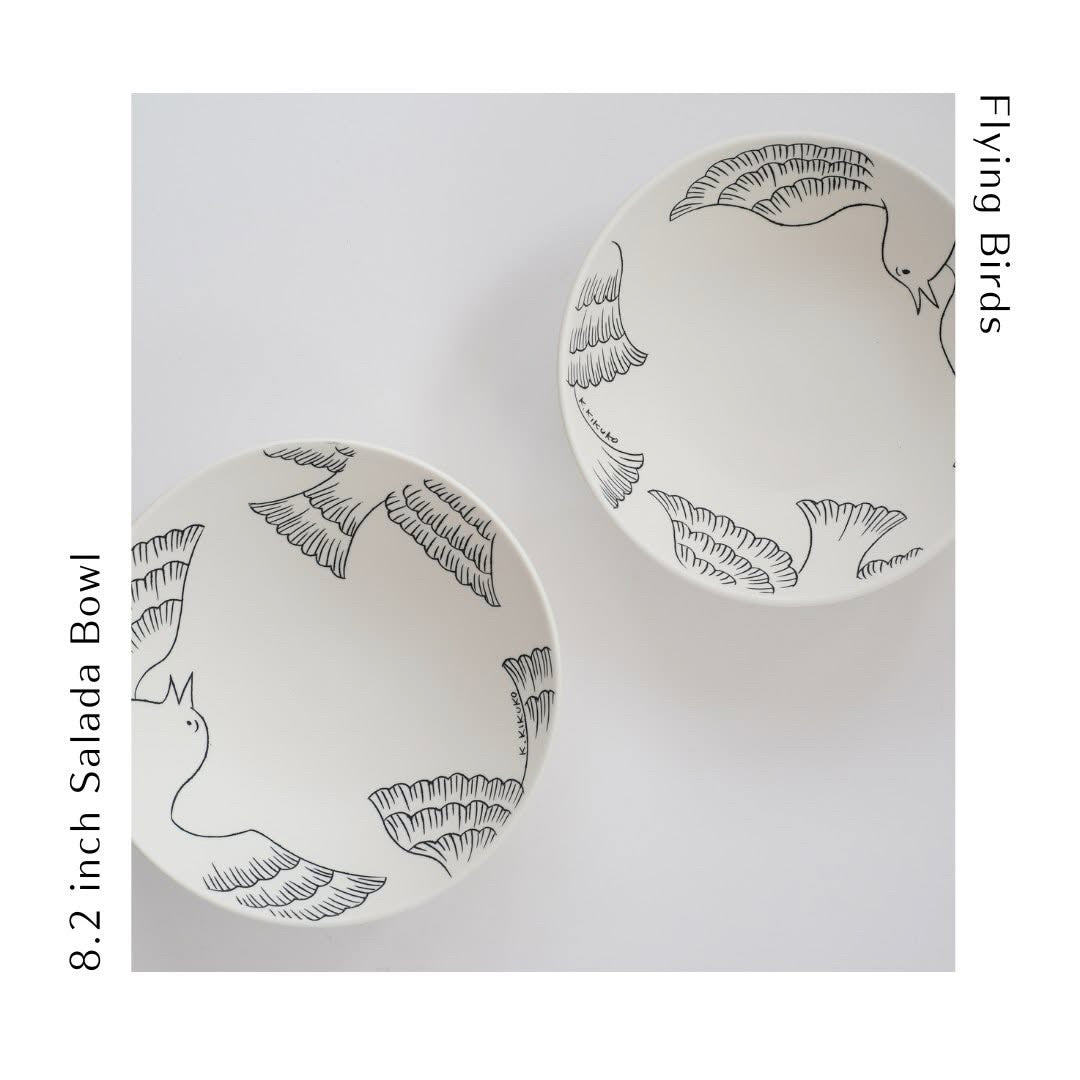 The 8" salad, pasta or decorative porcelain bowl is wheel thrown and then decorated in an inlay technique of flying birds.