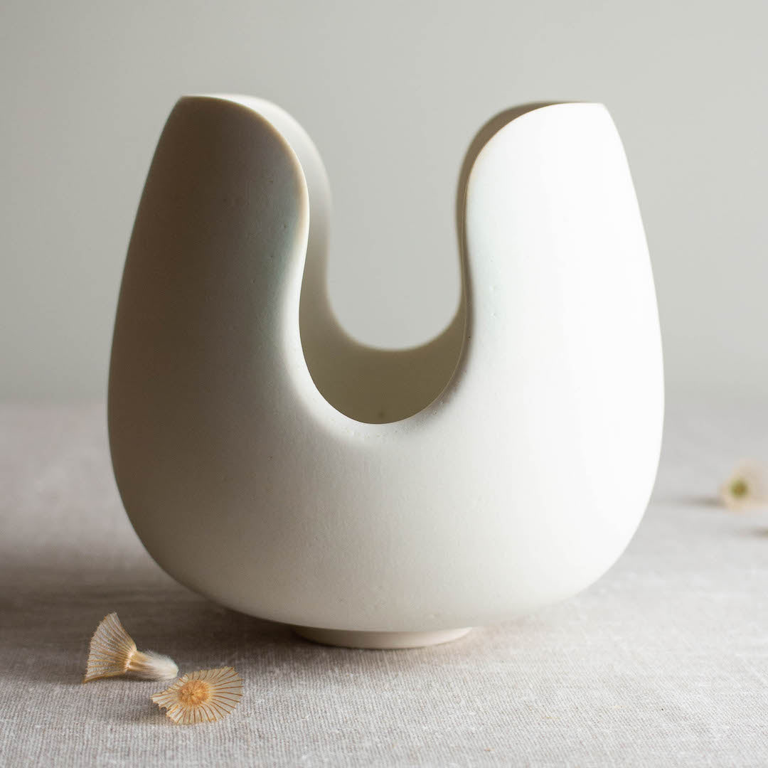 One of a kind white crystalline matte porcelain objects are mid-century Scandinavian inspired by Lisa Fleming.