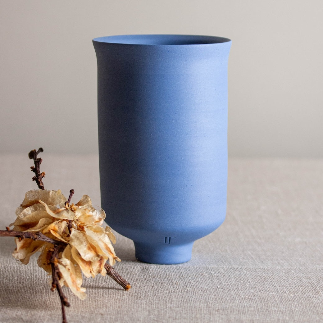 Lisa Fleming blue porcelain bowl form with flared foot, created on the wheel with Japanese Scandinavian simplicity in aesthetic and form.
