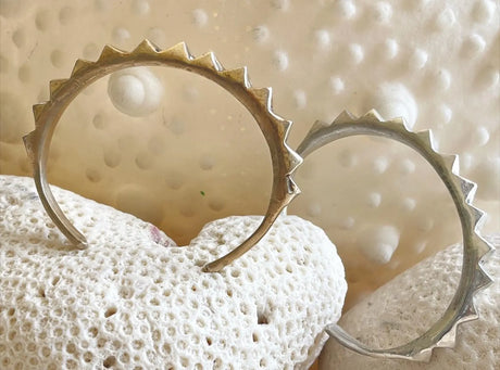 A cuff with studs to add edgy rocker vibes to your wrist stack! We love the solid structure but easy to wear design by Lotte Leopard.