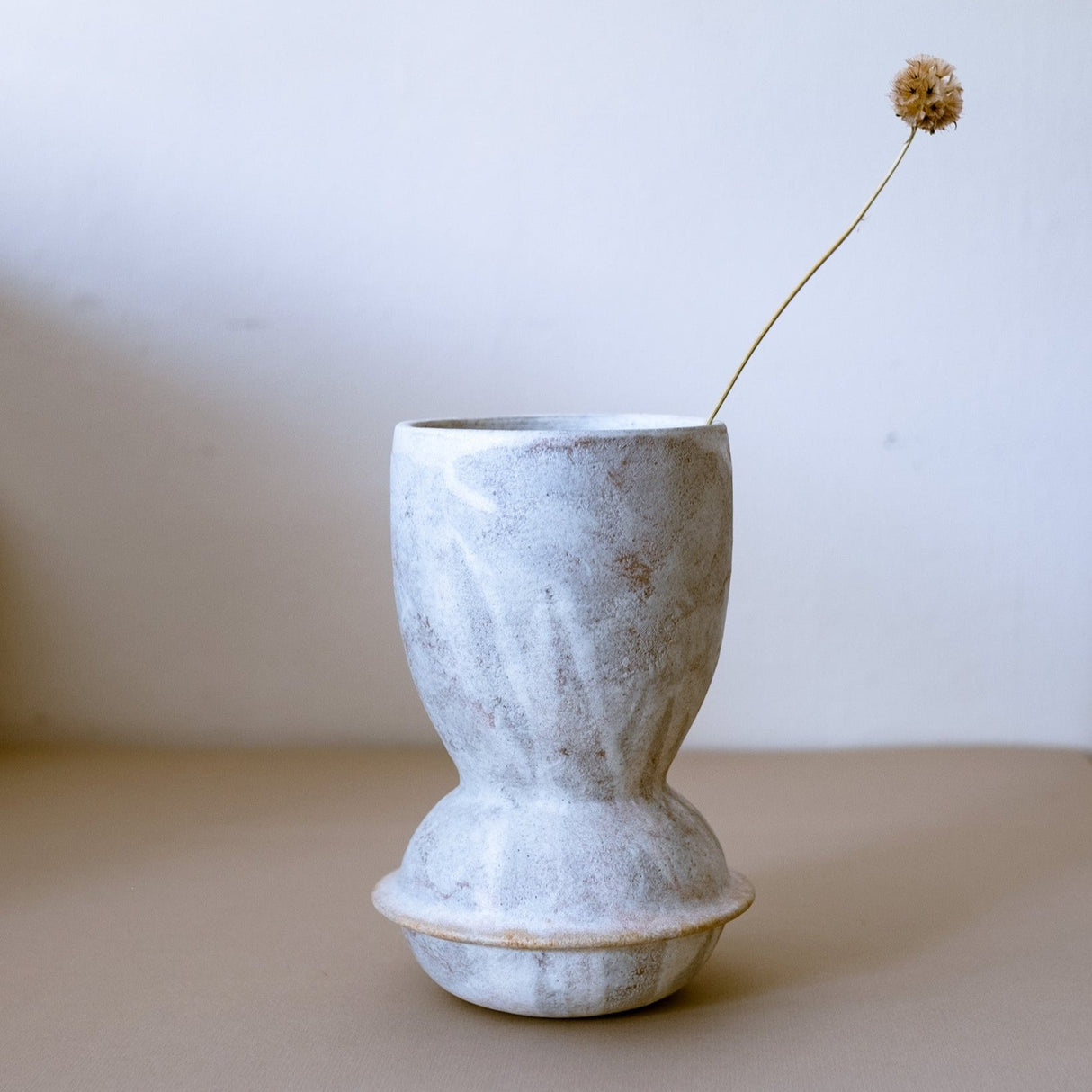 The Planet Series vases are inspired by planets encircled by their majestic rings. Different formations, just like the galaxies. Stone slip applied glaze pattern.