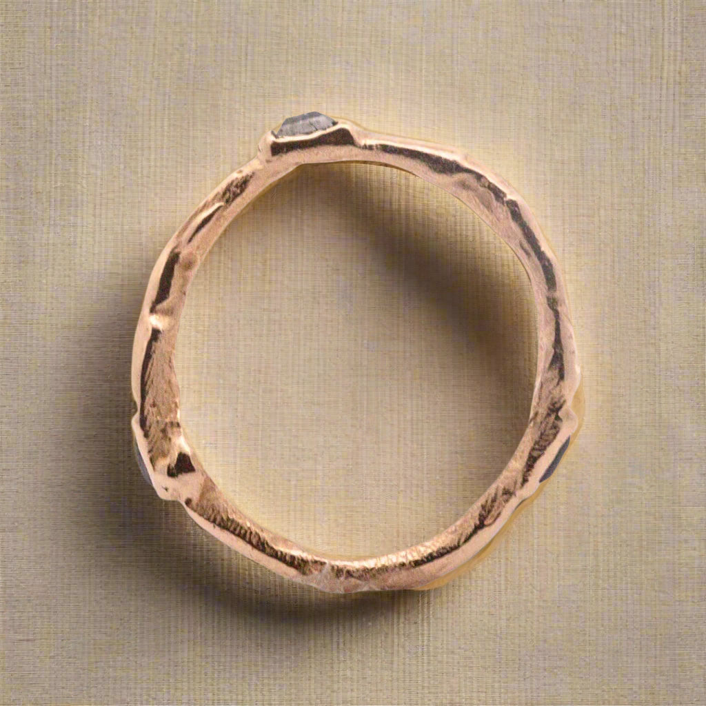 Einar is a narrow wavy yellow gold ring with an undulating form. Made for stacking or worn individually–designed to be part of a collection of layering rings by spreading them across fingers on both hands.