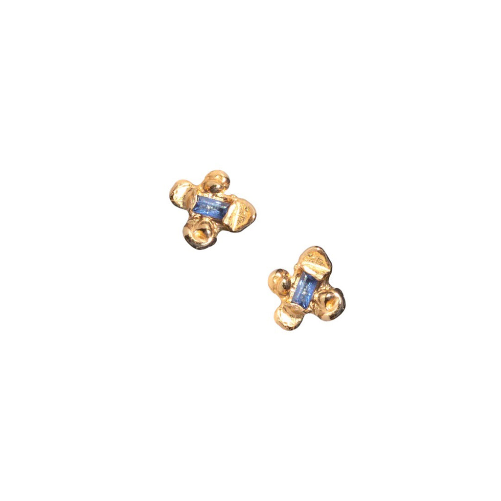 Idun is a four petal 14k yellow gold flower stud earring with ethically mined Sapphires from Montana.