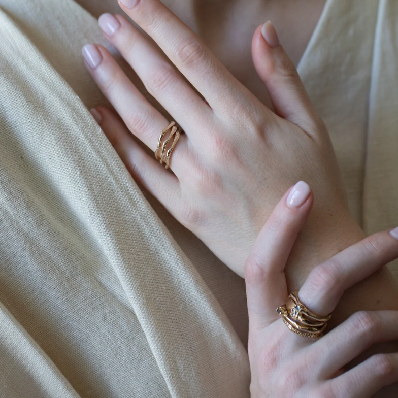 Einar is a narrow wavy yellow gold ring with an undulating form. Made for stacking or worn individually