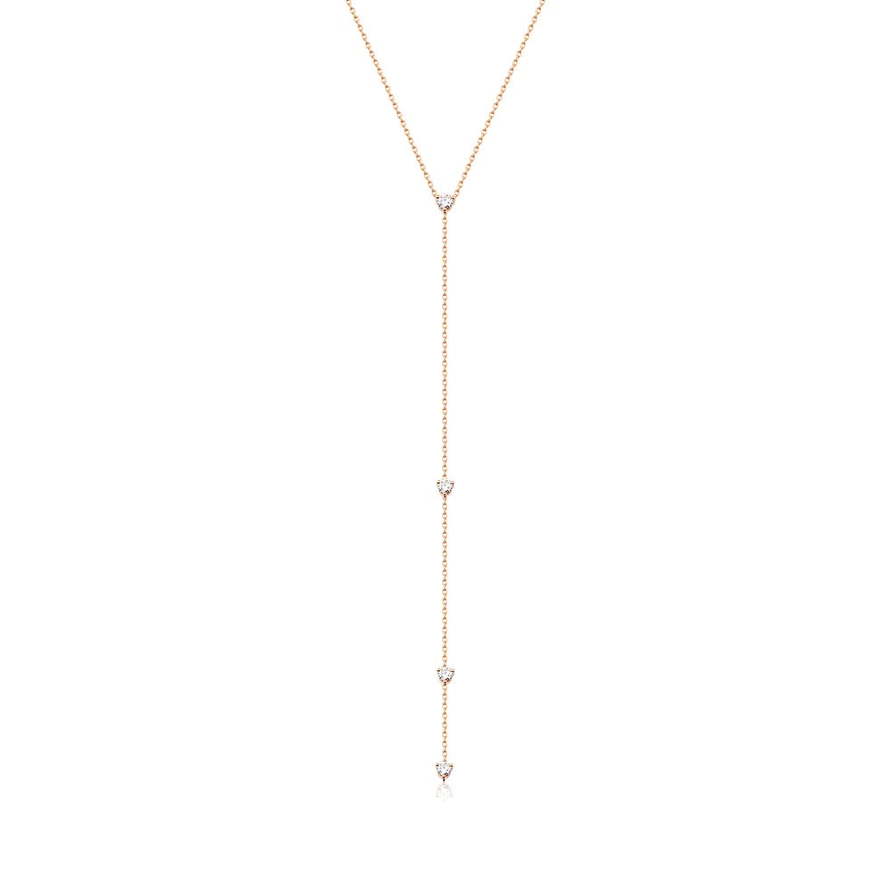 A gorgeous Y or lariat-style necklace in 14K yellow gold, rose gold or white gold. 4 round white diamonds are suspended along the lustrous gold chain. Shown in Rose Gold.
