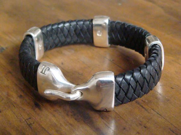 Jeffrey Levin sterling silver and braided black leather bracelet with 3 silver bands and handcrafted sleek hook clasp.