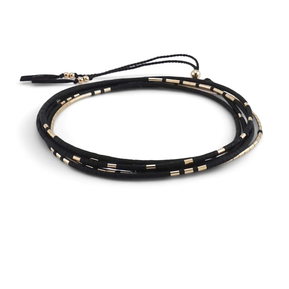 The Neso is a convertible necklace to wrap bracelet made with matte glass beads and gold beads.