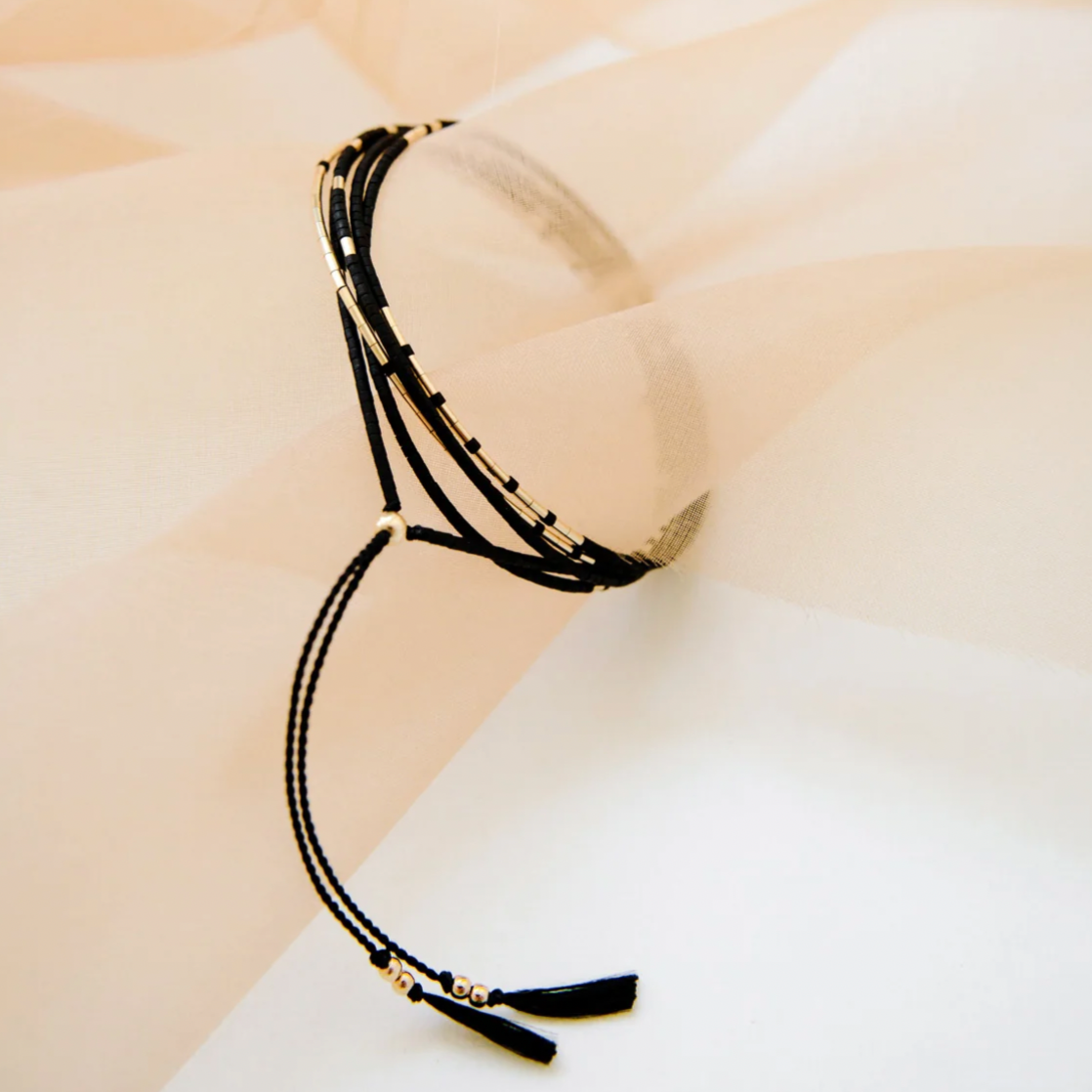 This piece is intended to be worn as a necklace or bracelet, and each piece is uniquely patterned so that no two are identical.