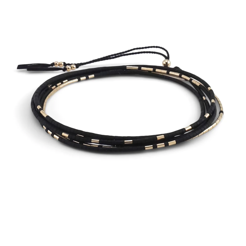 The Neso is a convertible necklace to wrap bracelet made with matte glass beads and gold beads. 
