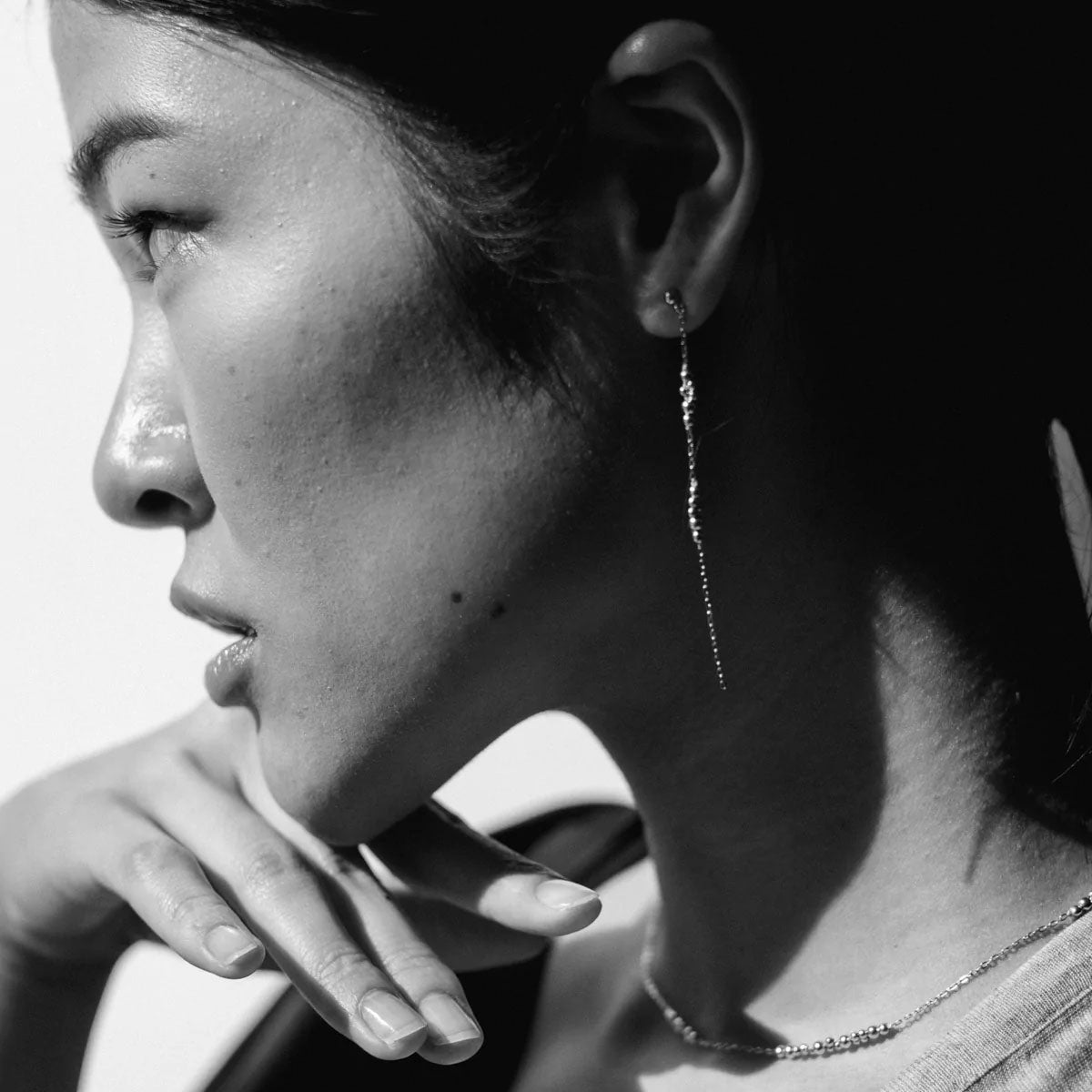 Rho Earrings are asymmetrical in design, with each earring featuring two different scattered segments of Abacus Row signature bubble pattern beadwork