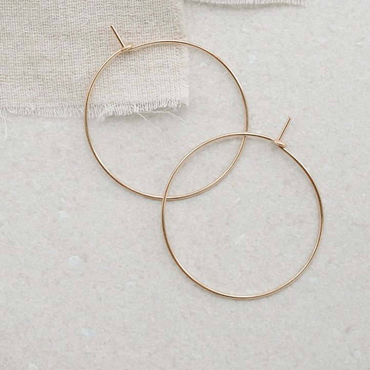 With Abacus Row's Simple Hoops, designer Christine Trac goes super minimalist. Each earring hoop is hand hammered from 14k gold-filled wire.