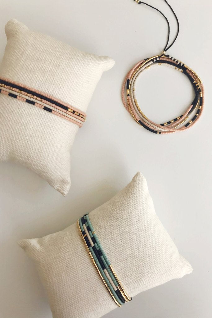 The Sonoran is a convertible necklace to wrap bracelet featuring playful patterns and designs made with Japanese glass beads. Sienna and Oasis.