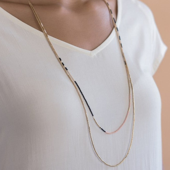 The Sonoran is a convertible necklace to wrap bracelet featuring playful patterns and designs made with Japanese glass beads.