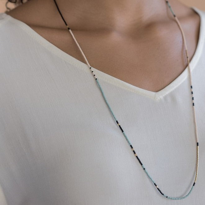 The Sonoran is a convertible necklace to wrap bracelet featuring playful patterns and designs made with Japanese glass beads. Oasis.