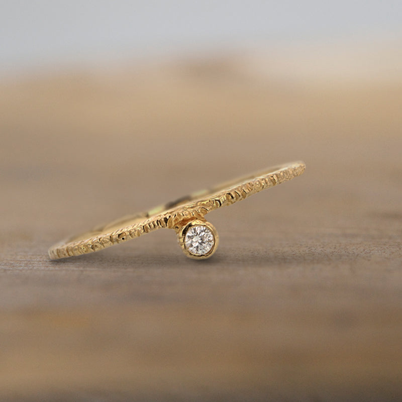 Danielle Welmond connected white diamond set next to yellow gold textured band