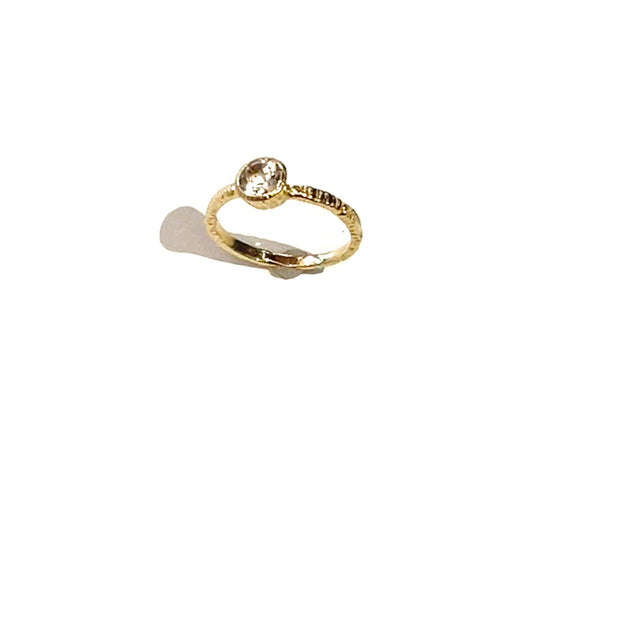 A new design from Danielle Welmond, the 14K gold connected side bezel setting shows off this brilliant white topaz in the most stunning way!