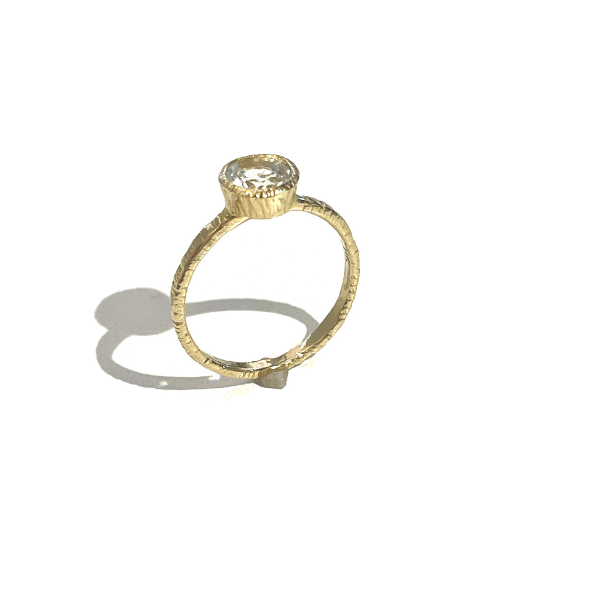 A new design from Danielle Welmond, the 14K gold top bezel setting shows off this brilliant white topaz in the most stunning way!