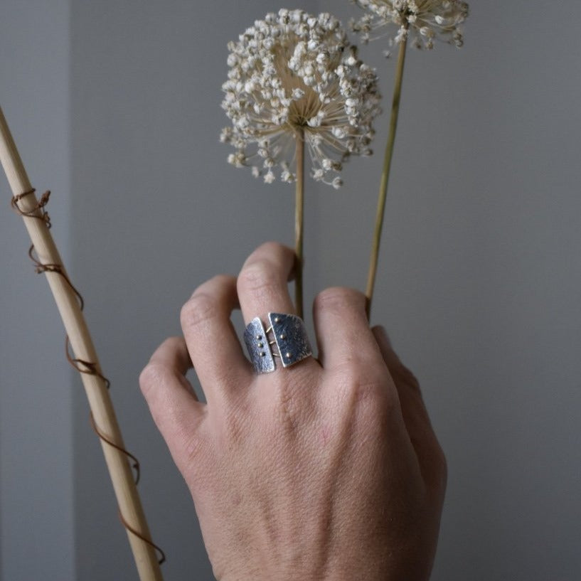 Esther Metals Binding Light ring is reticulated and oxidized sterling silver, bound with 14k torch formed rivets.