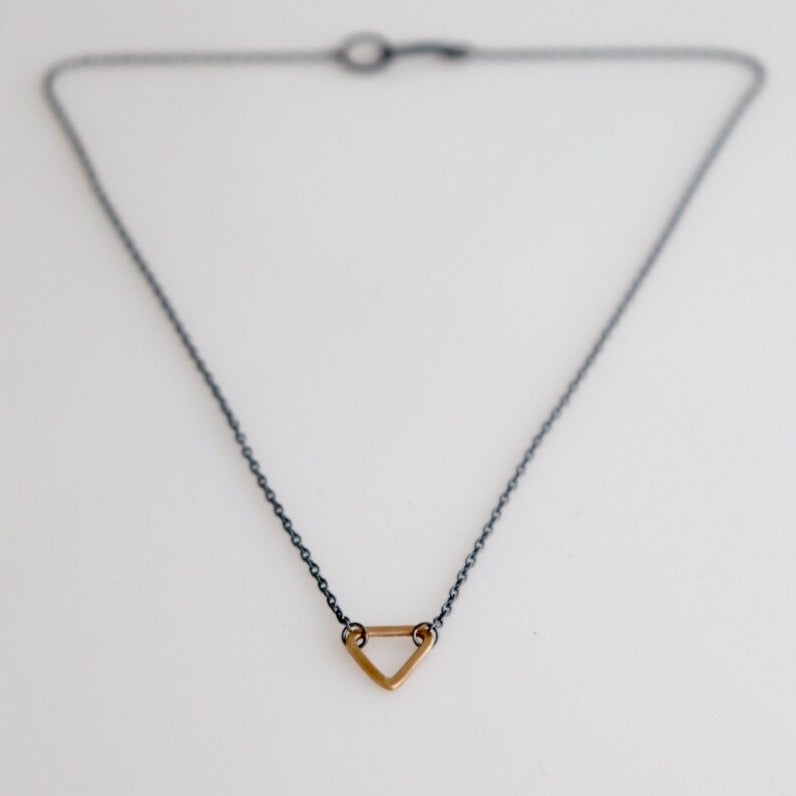 Esther Metals designed this everyday triangle necklace to be your lucky charm. Perfect on its own or layered with your favorite rotation.