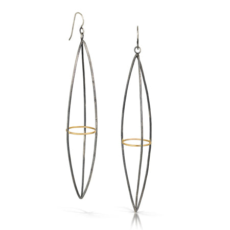 These dramatic earrings hold the Earth within the atmosphere or your inner thoughts among the cosmos. We love how the gold details pop in contrast to the oxidized silver. This version is extra long. 