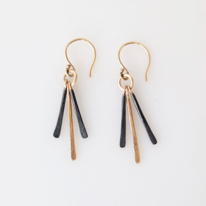 Three tendrils of mixed metals dance together, quietly “whispering” to you as you wear them.