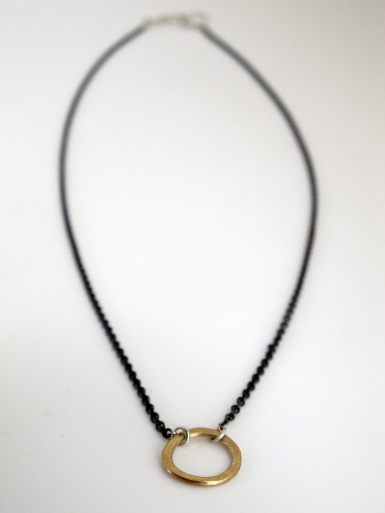 Esther Metals designed this everyday circle necklace as a perfect piece on its own or layered with your favorite rotation.