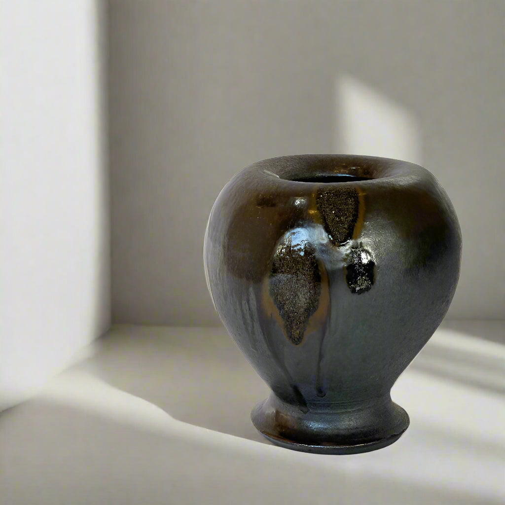 This one-of-a-kind wood fired balloon vase by Ian Hazard Bill has a gorgeous metallic glaze and drips from the kiln that turned to glass.