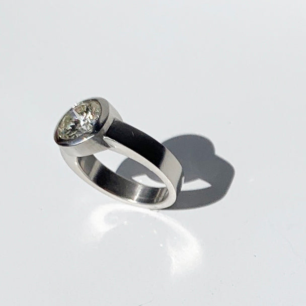 This platinum modern solitaire design originated as a bespoke engagement ring by Poet and/the Bench co-founder and goldsmith Jeffrey Levin.