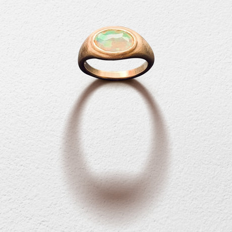 Poet and/the Bench goldsmith and co-founder Jeffrey Levin captured the beauty of this unique stone, hand-carving a yellow gold setting designed to bring the opal's best features to life.